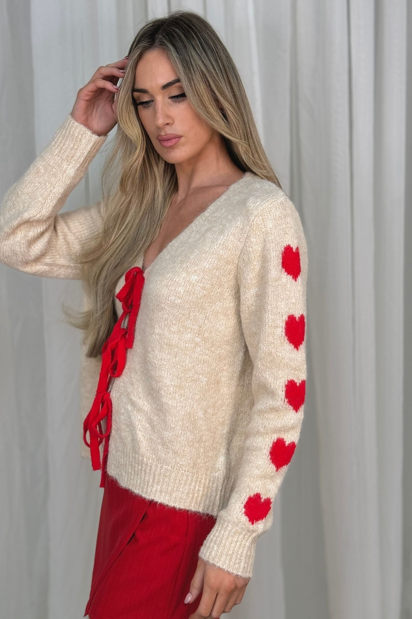 Kendra Red Bow Cardigan In Cream