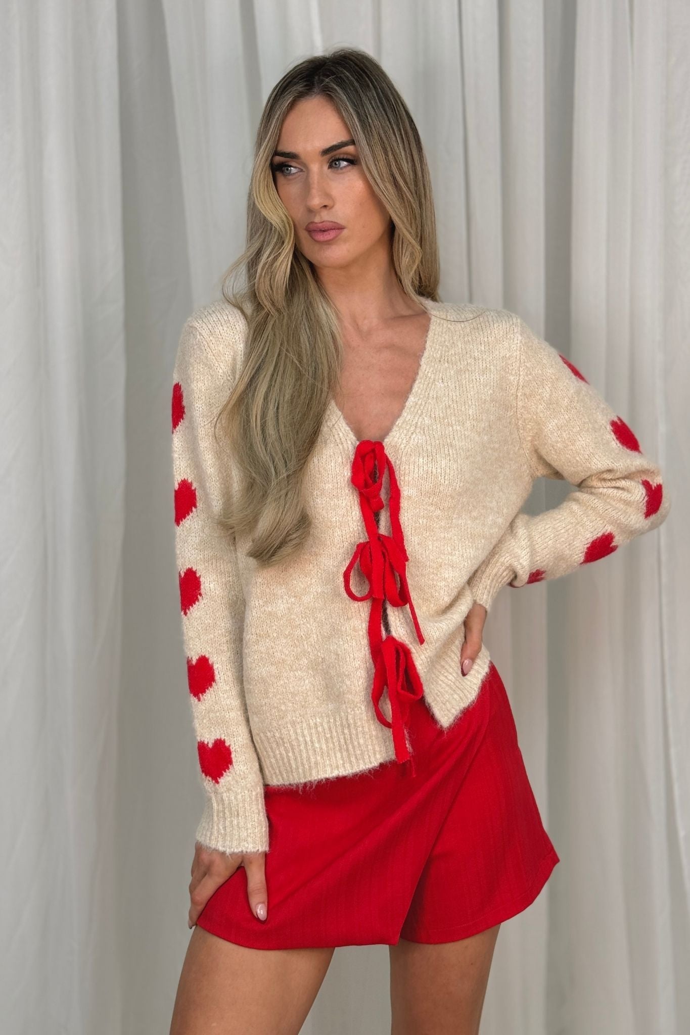 Kendra Red Bow Cardigan In Cream