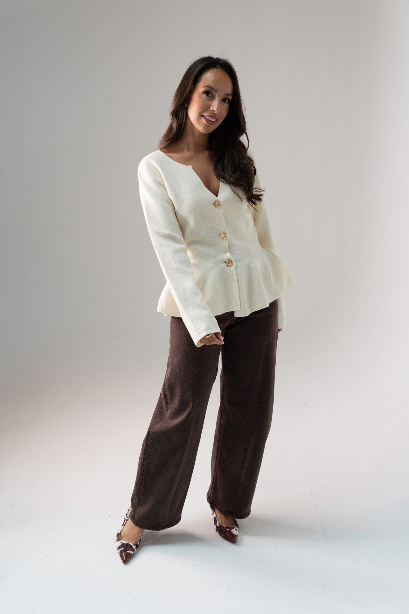 Ally Peplum Cardigan In Cream