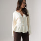 Ally Peplum Cardigan In Cream