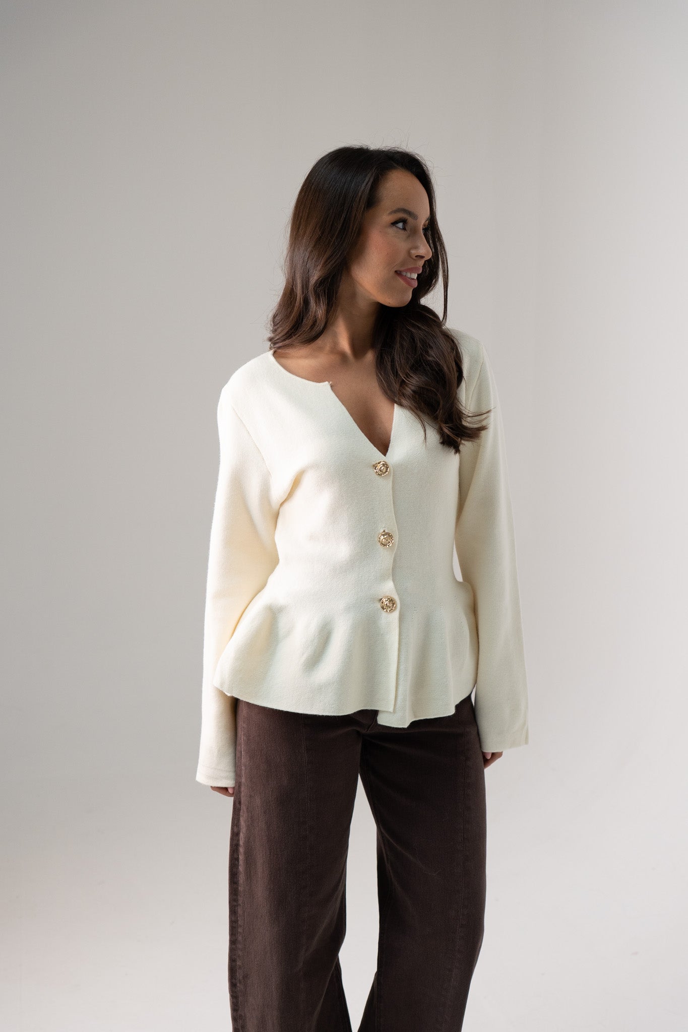 Ally Peplum Cardigan In Cream