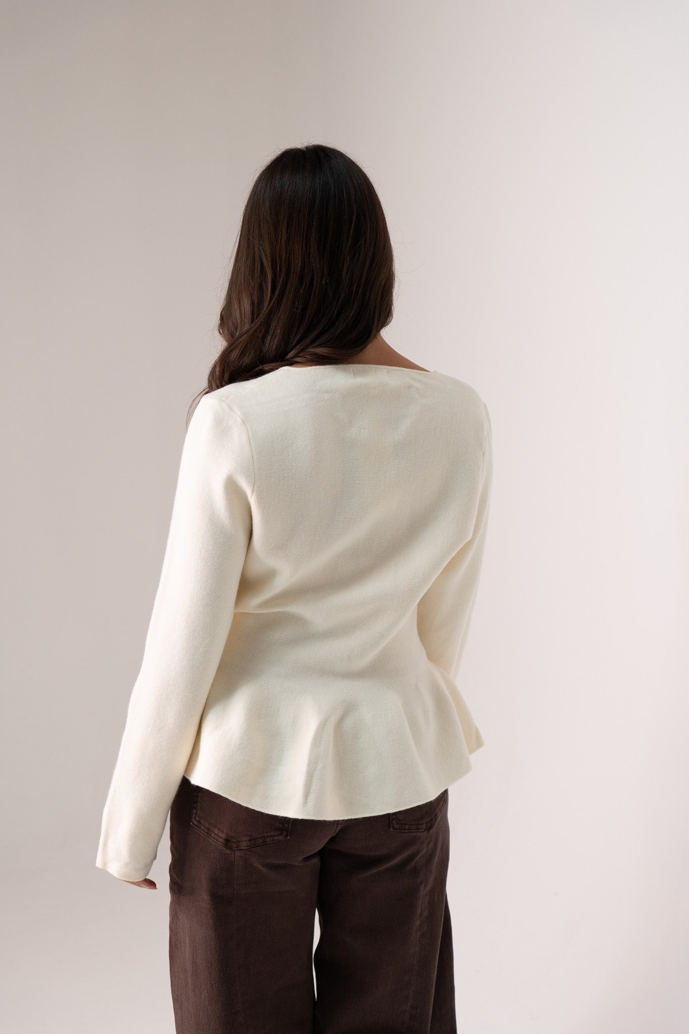 Ally Peplum Cardigan In Cream