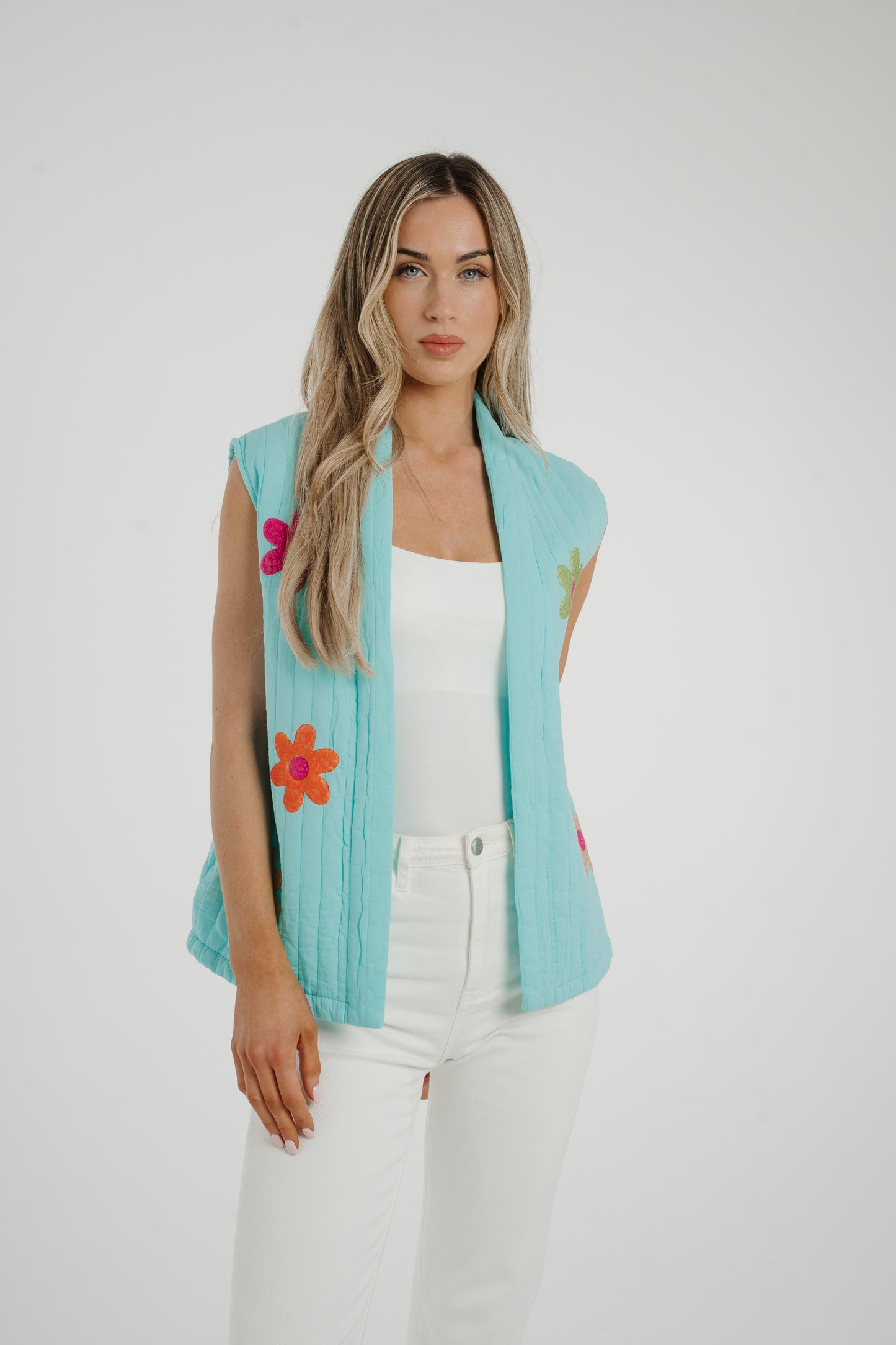 Poppy Floral Quilted Gilet In Turquoise