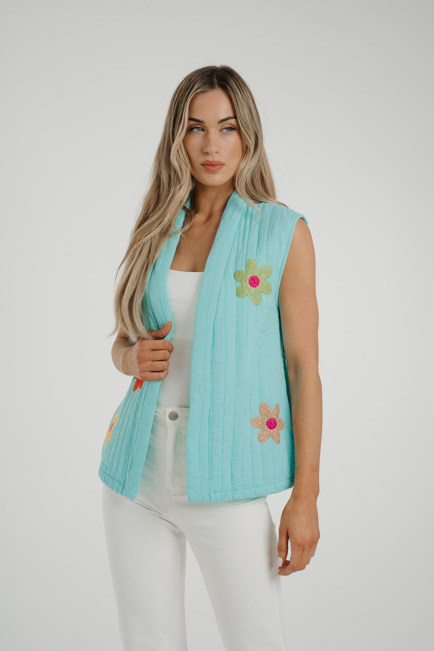 Poppy Floral Quilted Gilet In Turquoise