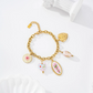 Olive Pink Floral Charm Bracelet In Gold