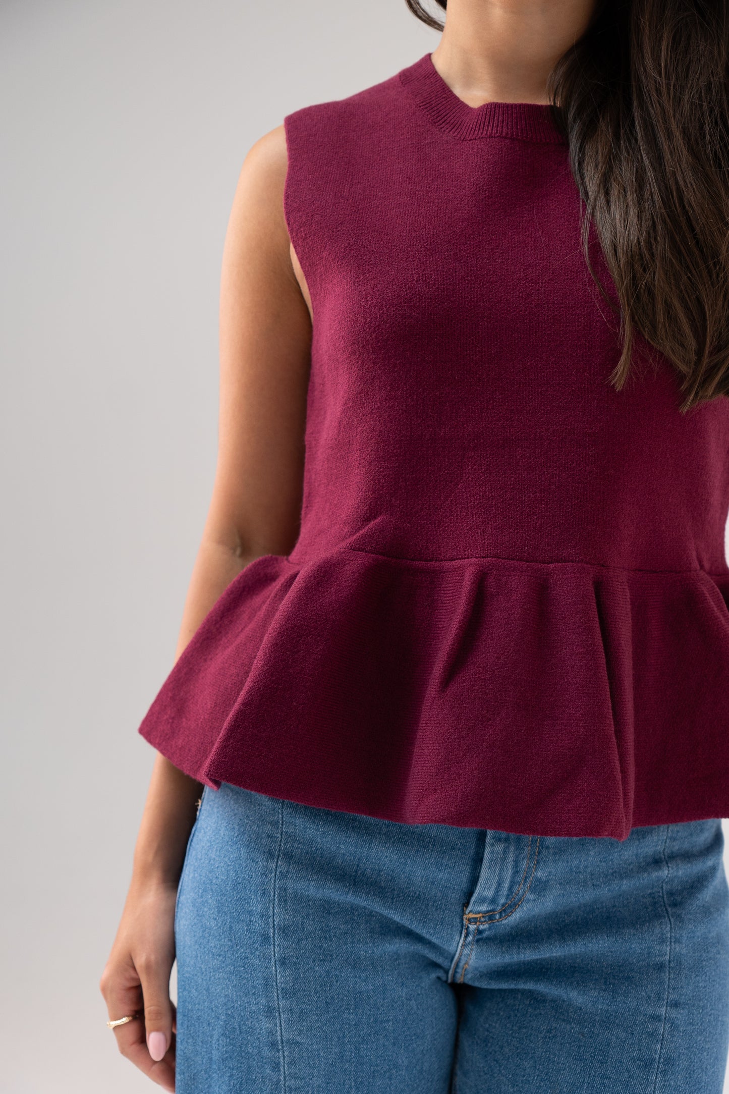 Kendra Sleeveless Peplum Top In Bordeaux