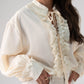 Kendra Tie Neck Ruffle Blouse In Cream