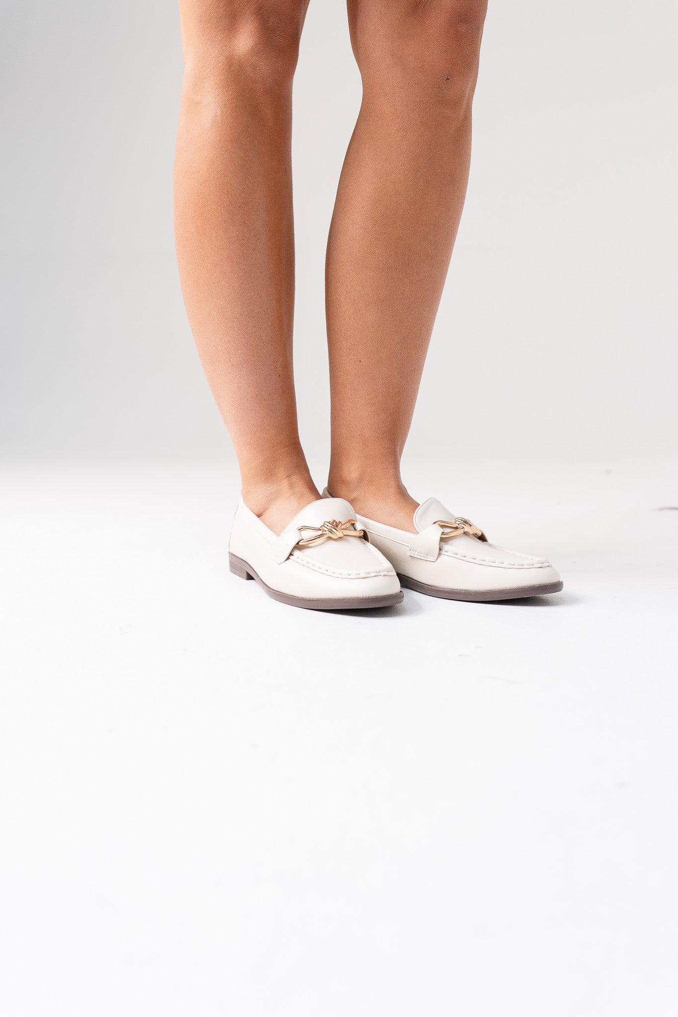 Sadie Buckle Faux Leather Loafer In Cream