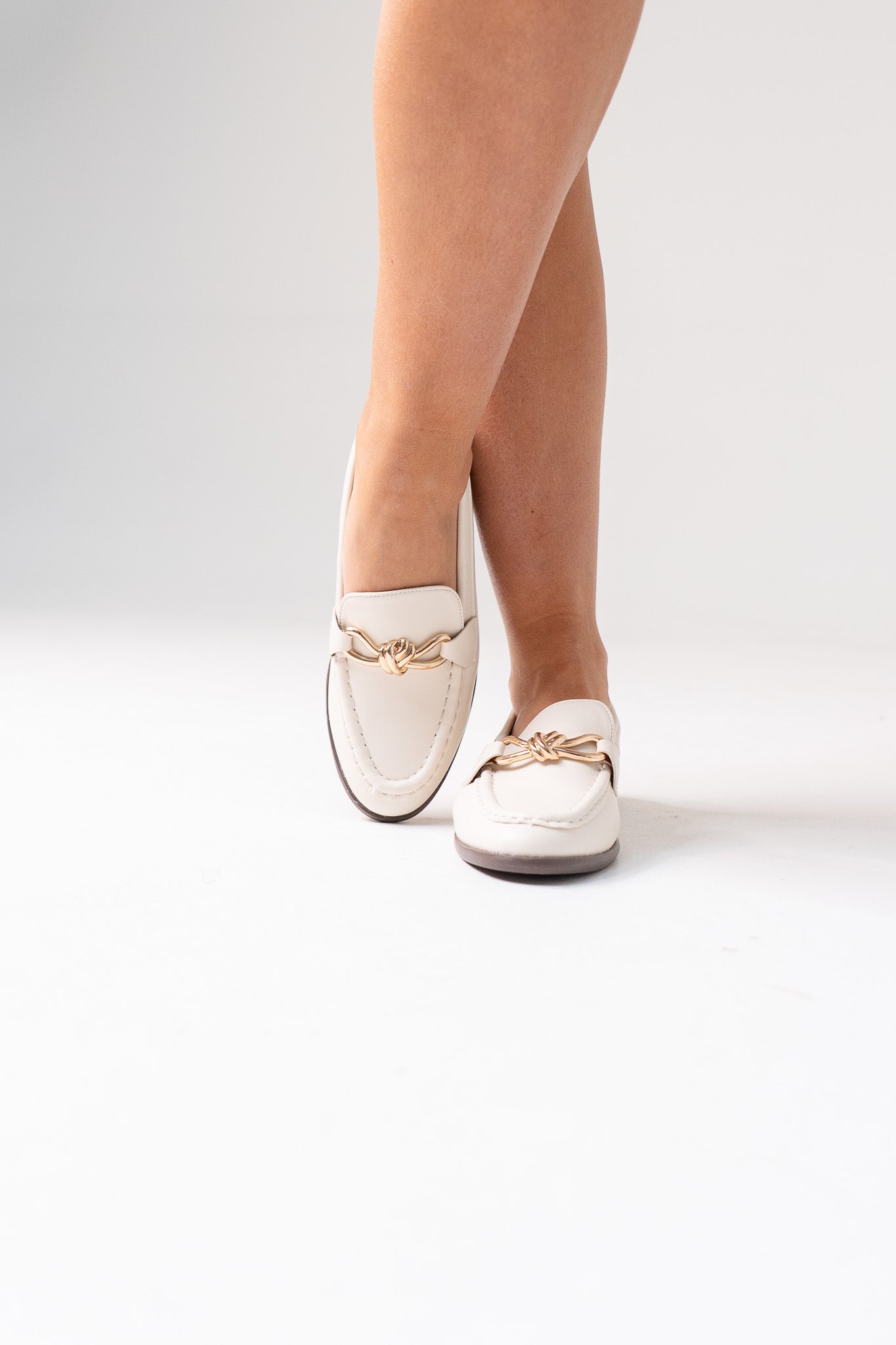 Sadie Buckle Faux Leather Loafer In Cream