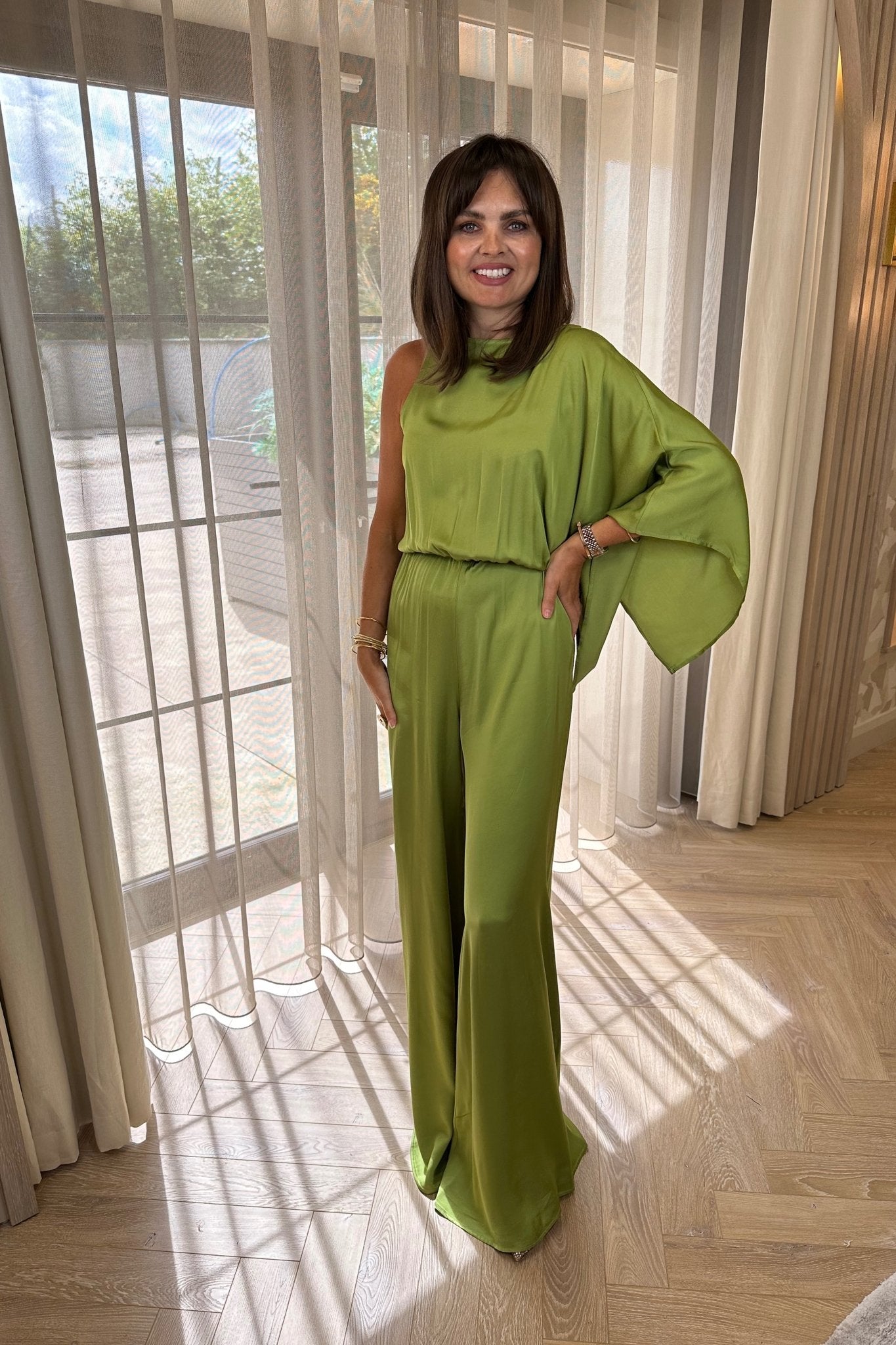 Pia One Sleeve Jumpsuit In Green - The Walk in Wardrobe